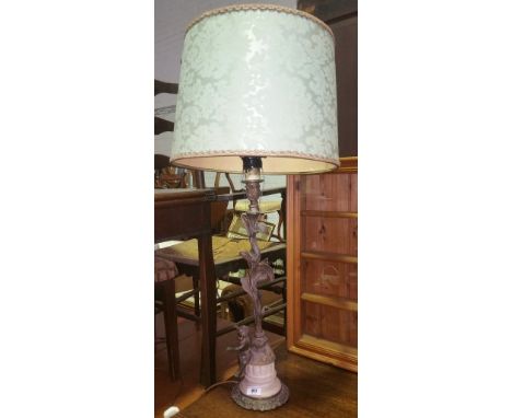 A 19th Century Metal & Marble Table Lamp with foliate support with seated cherub, with shade.