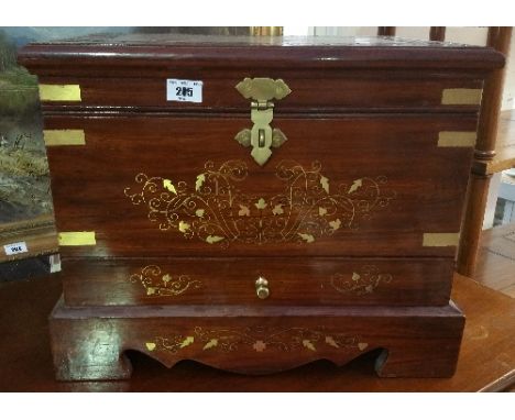 A Brass Bound Inlaid Hardwood Trunk; with one drawer and standing on bracket feet.