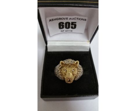 A White and Yellow 9ct Gold Ring in the form of a Lions Head, weight-9grams, Hallmarked, having six diamonds, (retail price- 