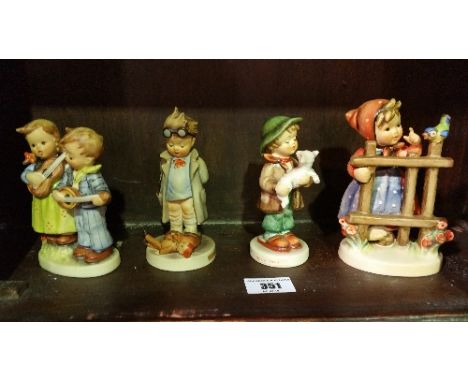 A Shelf of Goebel Figures.