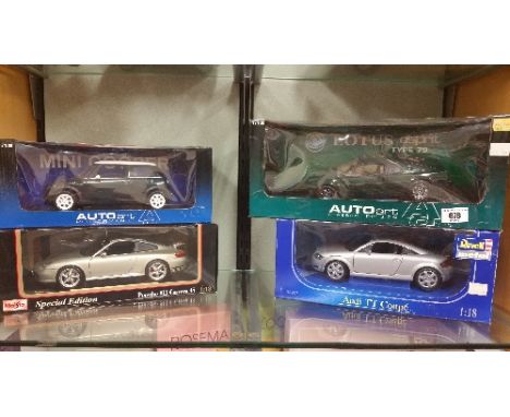 A Group of Four 1/8 Scale Di-Cast Models, to include a mini cooper, a porsche, an audi tt and a lotus, all boxed.