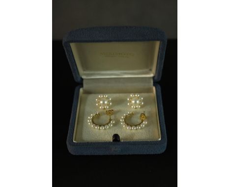 Two pairs of boxed cultured pearl earrings, by Mikimoto. One designed as a hoop of 3.6mm cultured pearls, the other as a 7.3m