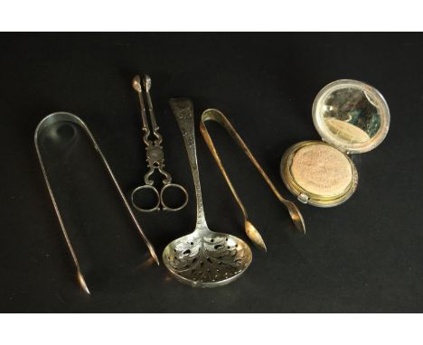 A collection of silver, including a engine decorated silver makeup compact, three pairs of sugar tongs and a foliate design s