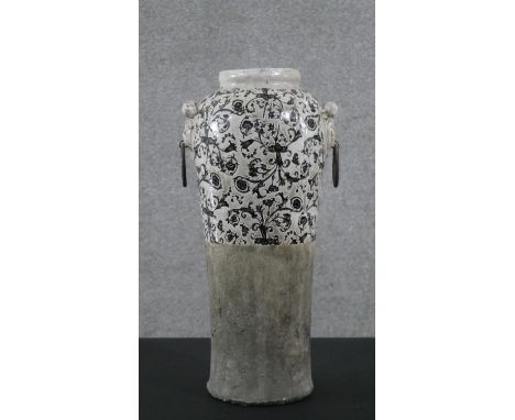 An Islamic style floral and foliate pattern twin handled ceramic vase. H.50 W.25cm 