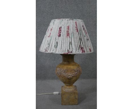 A ceramic stone effect classical design table lamp with relief fruit swag design. H.75 Diam.47cm 