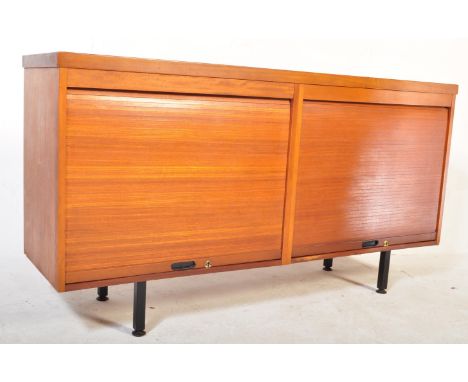 A retro vintage mid 20th Century teak wood tambour sideboard. Of rectangular form with twin rolling top opening to reveal a s