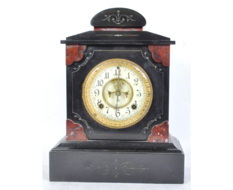 An early 20th century circa 1900 slate mantel clock of architectural form having Roman numerals to the chapter ring raised on