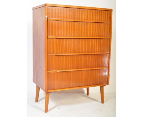 A retro vintage mid 20th Century c 1970's chest of drawers. Of rectangular form with a bank of five drawers, with long lipped
