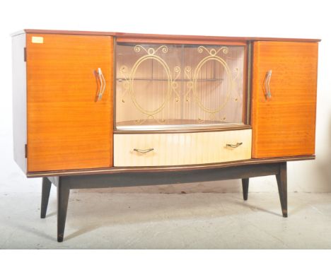 Hubbinett - A retro vintage mid 20th century teak sideboard. The sideboard having central cabinet space with glazed twin slin