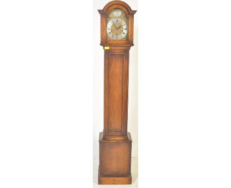 A 1920's solid oak cased Tempus Fugit Longcase / grandmother clock. Oak case with glass fronted hood with inset brass and sil