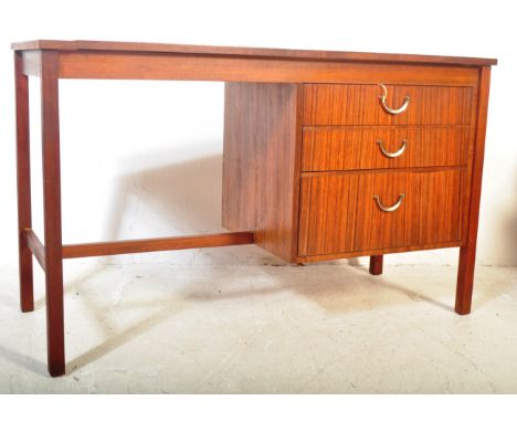 A vintage retro mid 20th century Meredew tea wood writing desk. The desk having rectangular top with kneehole space beneath a