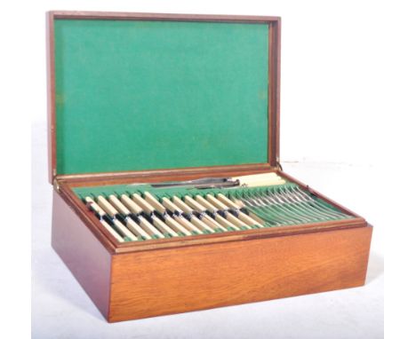 Edwardian Army &amp; Navy Stores canteen of cutlery within mahogany presentation case. The blades marked Rus Nor Stain - Shef