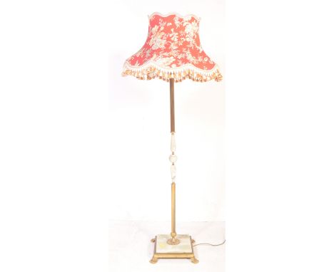 A late 20th Century vintage Hollywood Regency gilt brass and onyx standing lamp comprising of a floral decorated shade with c