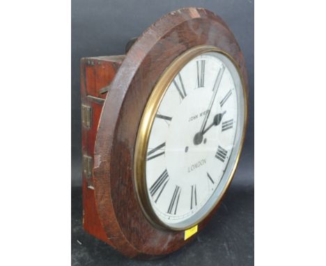 A 19th Century Victorian mahogany circular station wall clock by John Myers of London. The central dial having a white enamel