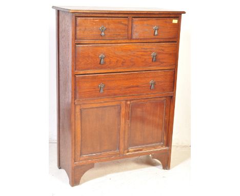 A vintage 20th Century, circa 1940's&nbsp; oak tallboy chest of drawers. With a rectangular flared top, two over two drawers 