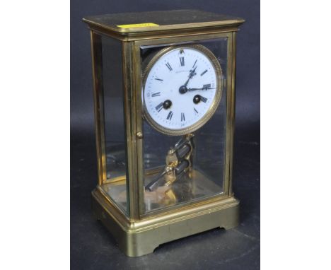 Tiffany &amp; Co - A large early 20th century Tiffany &amp; Co brass cased carriage clock. The carriage clock having a white 