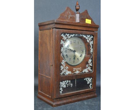 An early 20th century circa. 1920's mahogany cased mantel bracket clock. The mantle clock having a gilt face with Arabic nume