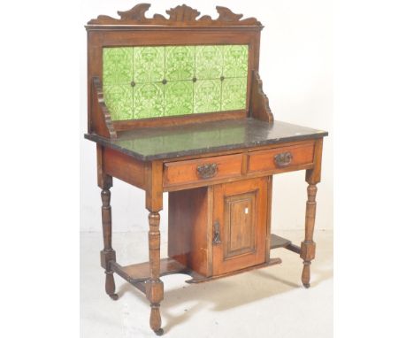 A Victorian 19th Century mahogany marble wash stand / cabinet. With green tile back, rectangular granite surface top, twin dr