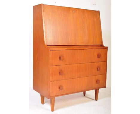 A retro vintage mid 20th Century teak wood Danish bureau. Having a drop down top opening to reveal a shelved interior, atop a