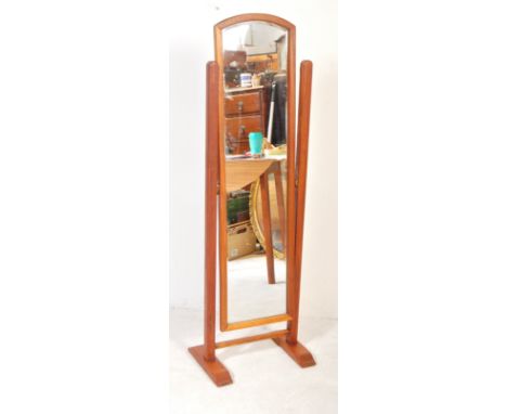 A retro vintage mid 20th Century teak cheval mirror. Having two upright supports, united by stretchers. With an arched teak f
