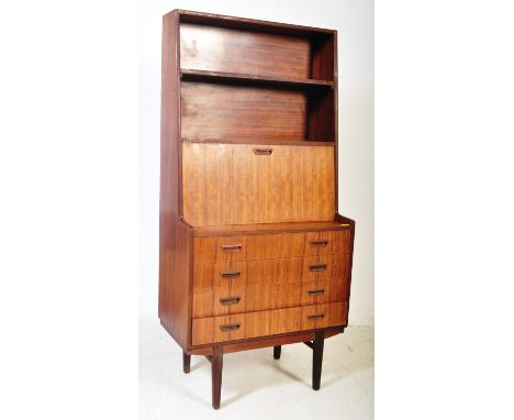 A vintage retro mid 20th century teak student bureau chest of drawers having two shelves over a fall front cupboard with appo