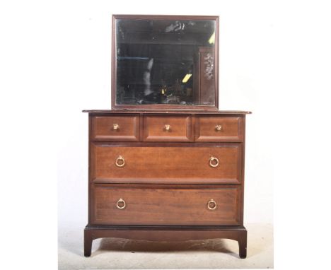 A vintage mid century Stag minstrel mahogany dressing table having a central mirror over three over two drawers raised on squ