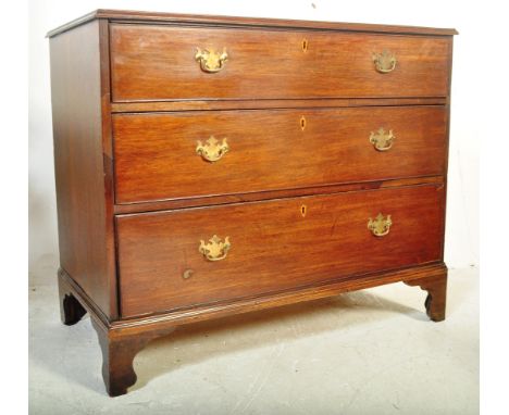 A 19th century George III mahogany chest of drawers having a flared chamfered top over a bank of three spacious drawers raise