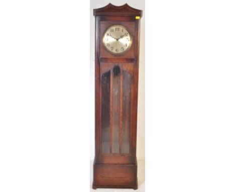 An early 20th century oak cased longcase clock having a gilt face with roman numerals to the chapter ring. Weights, key and p
