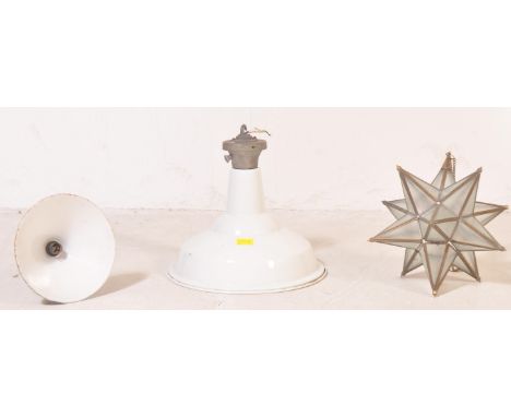 A vintage 20th century lighting pieces to include an industrial enamel pendant ceiling light shade, a similar blue enamel sha