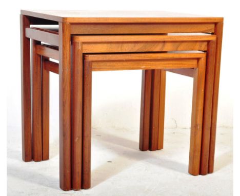 A retro vintage mid 20th Century teak nest of three tables. Of rectangular form on shaped supports. Measures approx 52cm x 55