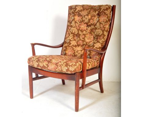 Parker Knoll - Mid 20th Century circa 1960's retro vintage beech wood armchair. Having a floral tapestry backrest and seat cu