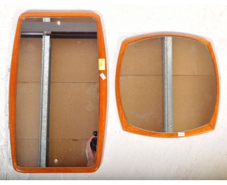 A pair of retro vintage 20th Century teak hanging wall mirrors. One of rectangular form the other curved square with mirror o