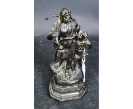 A 20th century spelter statue of William Tell carrying a crossbow over his shoulder raised on a stepped base.