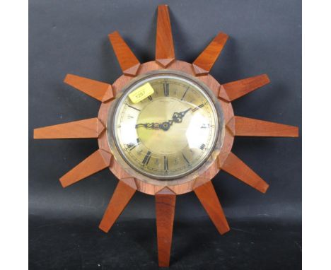 Anstey &amp; Wilson - A vintage retro mid 20th century Anstey &amp; Wilson sunburst clock having gilt metal frame with black 