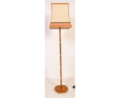 A retro vintage mid 20th Century brass and teak standard floor standing lamp. With a square cream and brown shade, on a teak 
