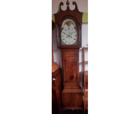 A 19th Century Mahogany cased longcase grandfather clock having an enamel dial with Roman Numeral chapter ring, faceted hands