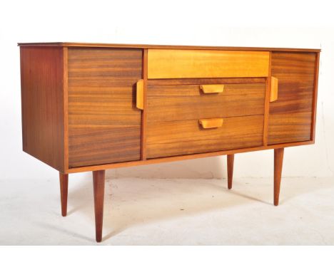 A retro vintage mid 20th Century circa 1960's Uniflex walnut wood sideboard. Of rectangular form with a bank of drawers to ce