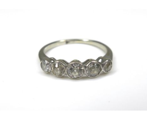 A five-stone diamond and white metal ring, size H/I, 1.9g. 