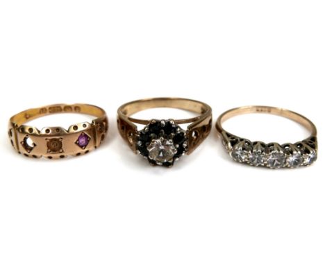 A group of three yellow gold rings, comprising a Victorian 15ct gold ring set with one ruby, a/f missing other two 'stones', 