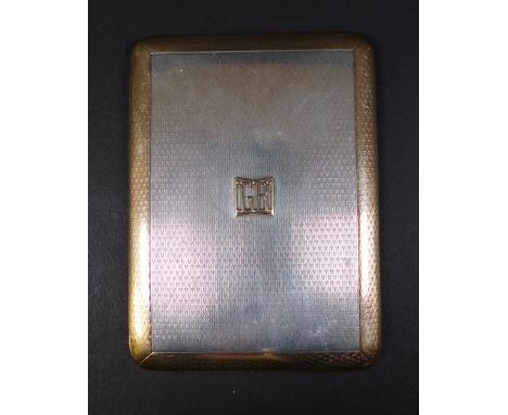 An Asprey George V silver and yellow metal cigarette case, mounted initials to the front 'GB', engine turned decoration all o