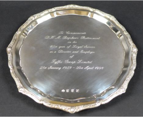 An Irish Elizabeth II silver tray, with Celtic motif encrusted pie crust rim, presentation engraved 'To Commemorate D. K. M. 