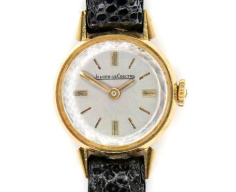 An 18k yellow gold Jaeger-LeCoultre lady's cocktail watch, the silver dial with gold batons, gold hands, signed 17 jewels mov