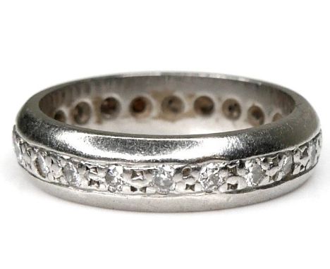 A white gold or platinum full eternity ring, set with twenty round cut diamonds, each 0.015ct, 1.5mm, marks obscured by stone