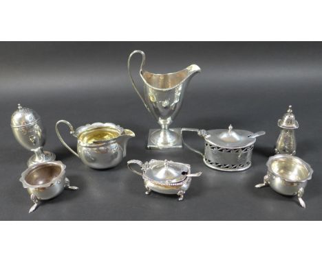 A group of silver items, including a Georgian silver helmet shaped cream jug, 14.5cm high, ovoid shaped pepperette, 9.5cm hig