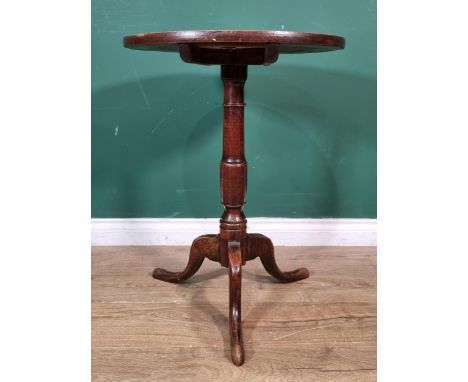 An 18th Century elm topped circular Candle Table on turned column and tripod supports 2ft 3in H x 1ft 8in D 