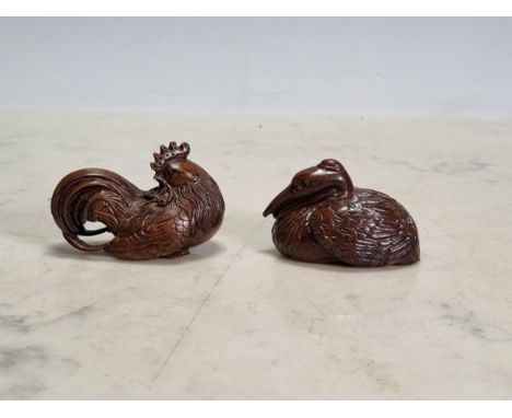 Two Oriental carved wood Netsuke of a Jungle Fowl and a Pelican, 2in L bear signatures  No obvious damage or repair