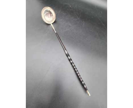 A Georgian Toddy Ladle with plain circular bowl and spiral whalebone handle 
