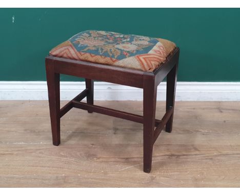 A 19th Century mahogany framed Stool, with drop in floral tapestry upholstered seat, raised on square tapered supports united