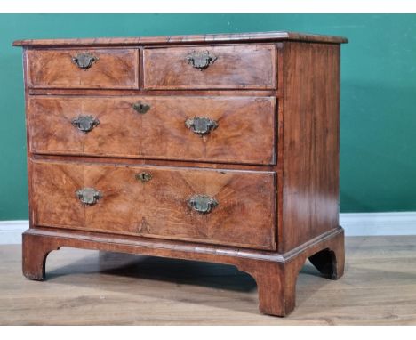 An 18th Century walnut Chest of two short and two long drawers with moulded top raised on bracket feet 3ft 4in W x 2ft 10in H