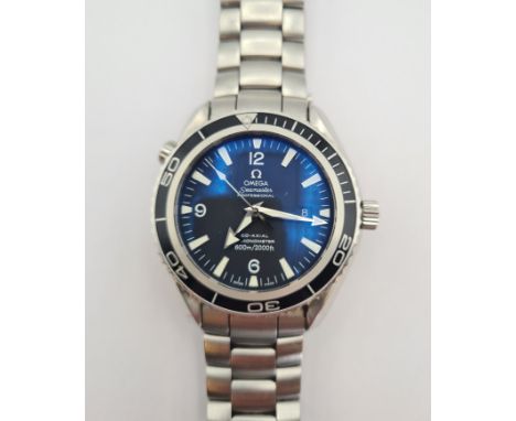A gentleman's Omega Seamaster Professional Planet Ocean Wristwatch the black dial with arabic numerals at quarters the remain